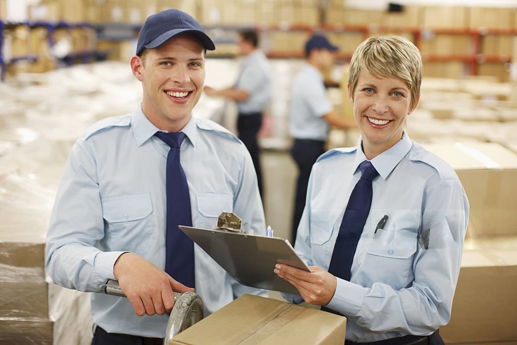 Logistics staff reviewing shipment paperwork
